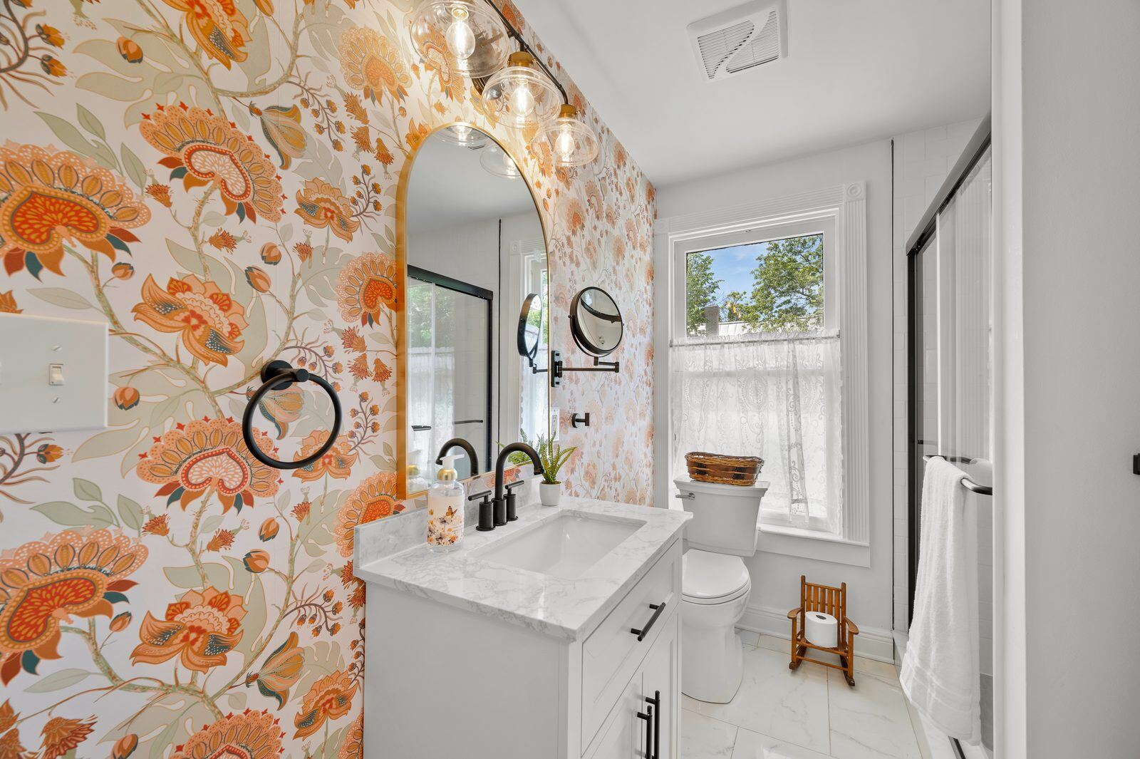 A salvage-yard mirror styled with found stone at the Craven House