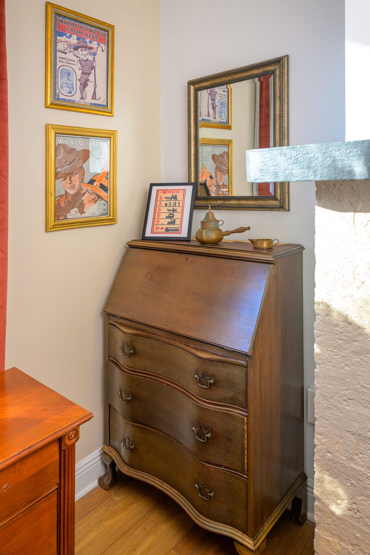 A styled antique secretary desk tucked in a corner of the Craven House