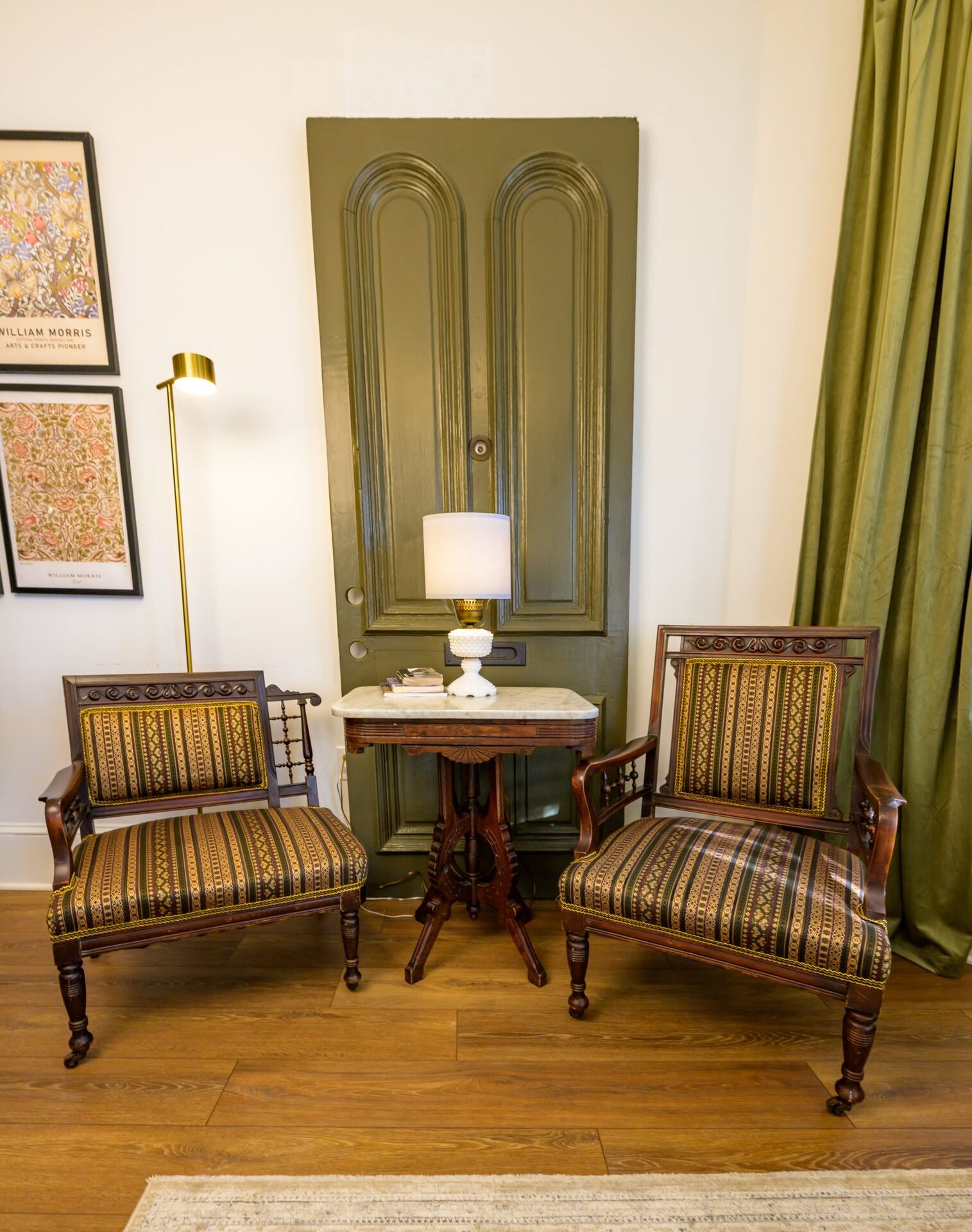 A cozy sitting nook framed by drapery at the Craven House