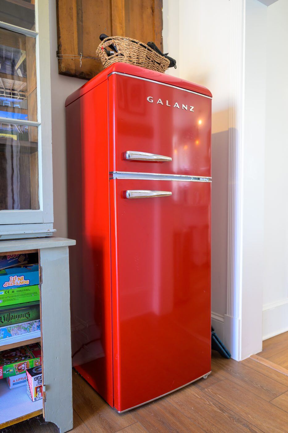 A vintage cherry-red refrigerator styled in the Craven House kitchen
