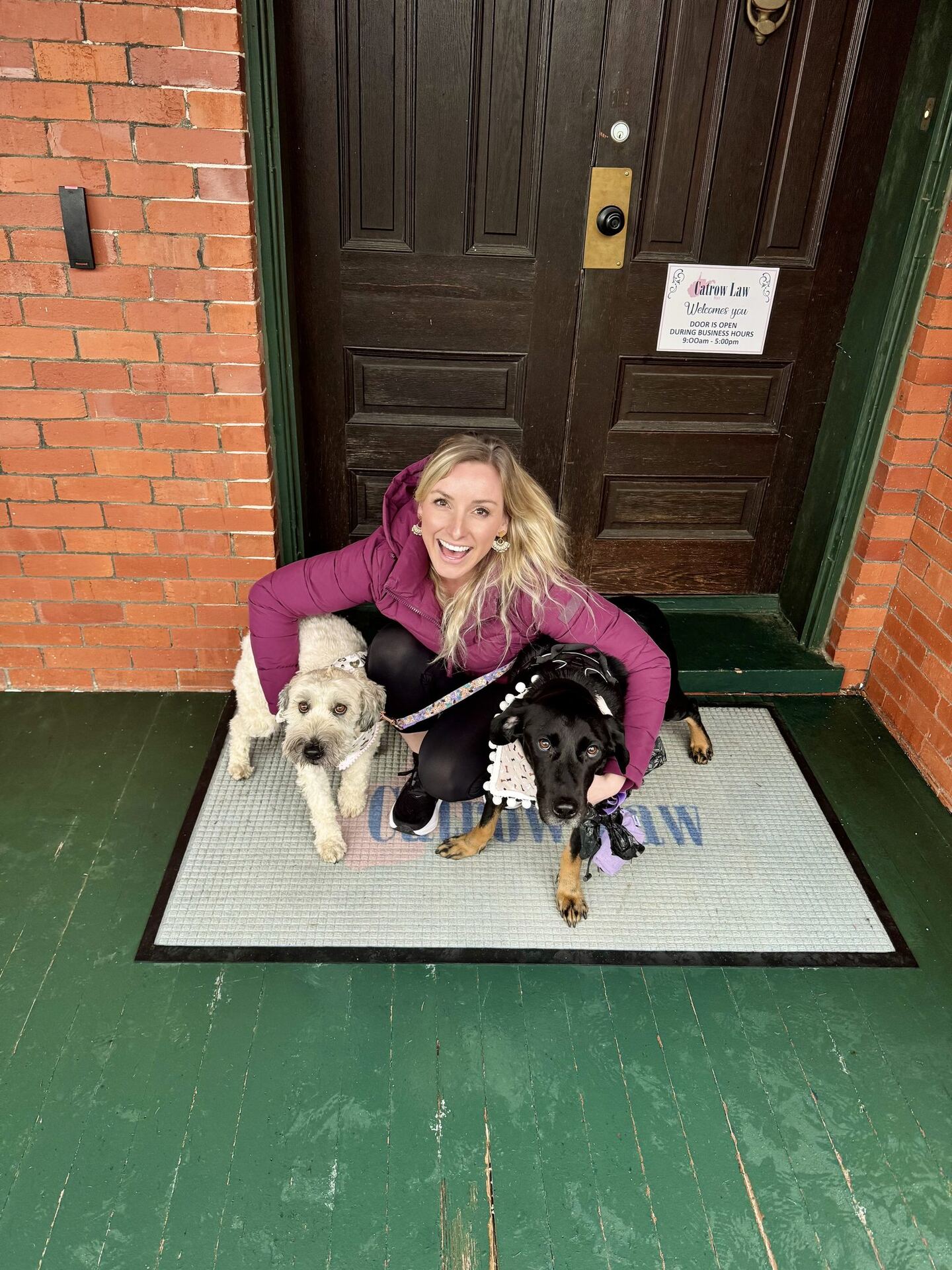 Lexie De Stefano with her rescue dogs at the front door of the Craven House